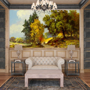 Hand-painted wall mural featuring golden forest trees, a winding pathway, and warm sunlight illuminating a peaceful woodland landscape.