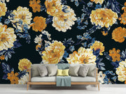 Midnight bloom wall mural featuring large yellow and cream flowers with deep blue foliage on a dark background, creating a dramatic and elegant room atmosphere.