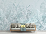 Soft blue palm leaf wall mural featuring oversized banana leaves on a light pastel background, perfect for modern interiors.