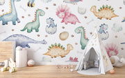 Watercolor dinosaur wall mural featuring pastel-colored dinos, dino eggs, and footprints for a fun nursery or kids' room.