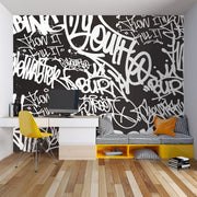 Black and white urban graffiti wall mural with bold typography, perfect for modern home or office decor.