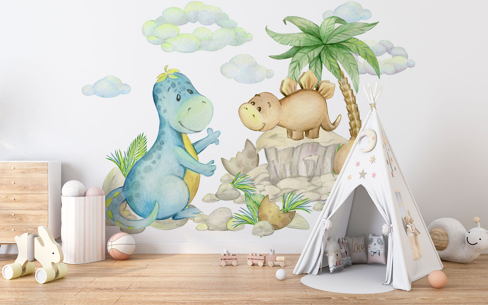 Cute dinosaur wall mural with watercolor-style dinosaurs, tropical plants, and soft pastel clouds, perfect for nurseries, kid's bedrooms, and playrooms.