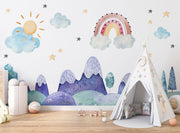 Watercolor kids' room mural with pastel mountains, a rainbow, a sun, clouds, and stars for a dreamy, playful atmosphere.
