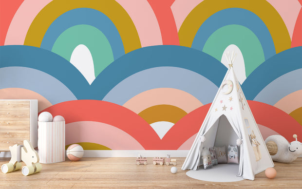 Colorful retro rainbow mural in a kids playroom with teepee tent, pastel toys, and playful decor.