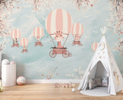 Whimsical kids’ wall mural with baby animals in hot air balloons, cherry blossoms, and a pastel sky—perfect for nurseries and playrooms.
