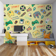 Room interior with gaming-themed wallpaper, desk, and colorful chair.
