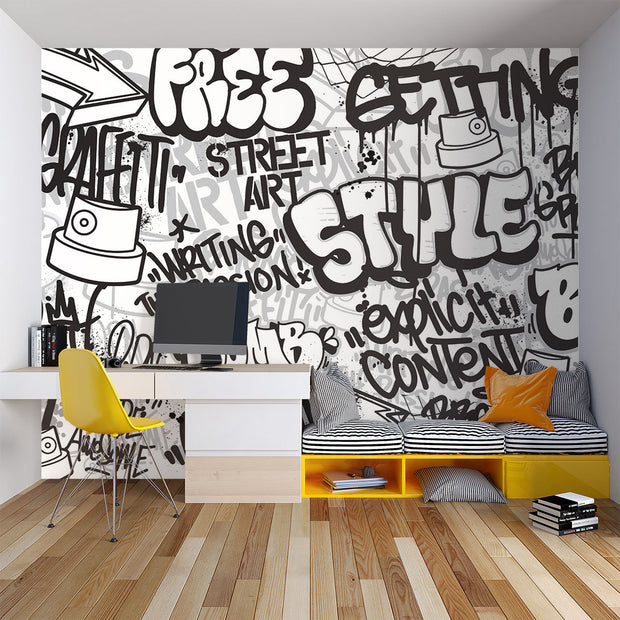 Graffiti wall mural with black-and-white street art typography and spray paint elements, ideal for urban-inspired bedrooms or creative spaces.