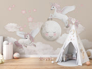 Whimsical Unicorn and Moon Wall Mural with flying unicorns, a smiling moon, pink stars, and fluffy clouds. Perfect fantasy decor for children's rooms.