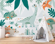 Kids’ bedroom wall mural featuring cute dinosaurs like triceratops, sauropod, and pterodactyls in a soft leafy landscape design.