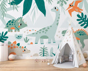 Kids’ bedroom wall mural featuring cute dinosaurs like triceratops, sauropod, and pterodactyls in a soft leafy landscape design.