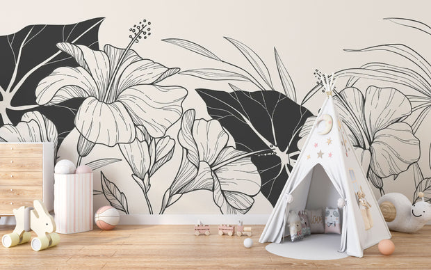 Minimalist playroom with wood flooring, teepee tent, and elegant black and white flower wall mural.