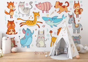 Colorful cartoon animal wall mural in a children's playroom featuring a fox, lion, bunny, shark, elephant, and more