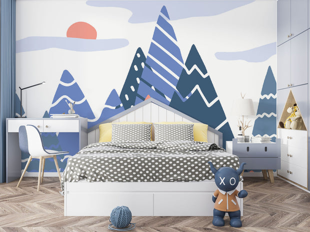 Adventure Peaks wall mural featuring abstract mountain shapes in blue and peach tones with a sun and clouds, styled in a boy’s bedroom.