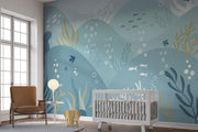 Underwater-themed ocean wall mural featuring fish, seaweed, bubbles, and rolling waves in soft blues and greens. Ideal for kids’ rooms and ocean-inspired interiors.
