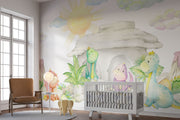 Pastel dinosaur wall mural with soft watercolor-style dinosaurs, a cozy stone cave, lush greenery, and a glowing sun, perfect for nurseries and playrooms.