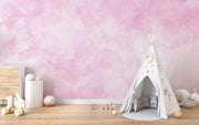 Blush Dreams soft pink watercolor wall mural in a kids nursery.