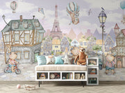 A whimsical Paris-inspired nursery wall mural featuring teddy bears on scooters and bikes, cobblestone streets, and the Eiffel Tower in pastel tones.
Perfect for nurseries or playrooms, this design combines a European cityscape with playful details, creating an enchanting environment for your little one.
