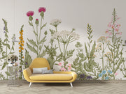Meadow Bloom Wall Mural featuring delicate wildflowers and lush greenery on a soft-toned background.