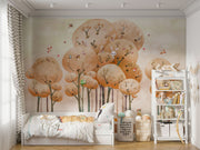 Woodland adventure wall mural with illustrated trees, animals and playful nature elements in a cozy children's room setting.