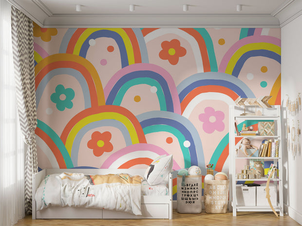 Kids wall mural with retro-style rainbow arches and colorful flowers in a playful, children's bedroom.
