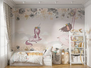 A whimsical nursery wall mural featuring a pink unicorn resting on clouds, a girl swinging with floral details, and soft pastel tones for a dreamy ambiance.