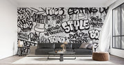Graffiti wall mural with black-and-white street art typography and spray paint elements, ideal for urban-inspired bedrooms or creative spaces.