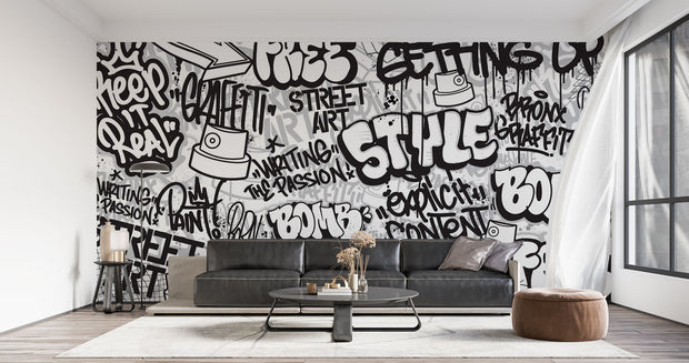 Graffiti wall mural with black-and-white street art typography and spray paint elements, ideal for urban-inspired bedrooms or creative spaces.