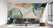 Absract floral wall mural decorating a living room with a large leather sofa.