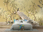 Golden Bloom wall mural with a cream peacock, flowering tree branches, and birds on a golden background in an elegant, Chinoiserie-style interior.