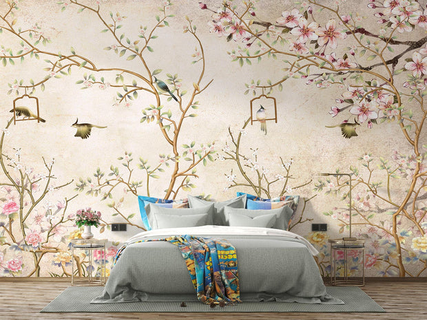 Elegant bedroom interior featuring a pastel Chinoiserie wall mural with delicate cherry blossoms and birds, decorating a bedroom.
