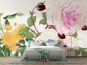Wall mural with vintage-style pink and white roses, yellow chrysanthemums, and green foliage decorating a bedroom.