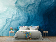 Deep blue abstract wall mural with flowing textures, creating a calming and elegant bedroom atmosphere.