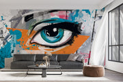 Abstract eye graffiti wall mural with bold blue eye, orange and teal splashes, and street art-inspired brushstrokes.