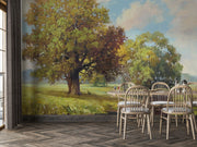 Hand-painted style wall mural featuring golden trees, a countryside meadow, and a walking path under a soft sky.