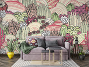 Desert bloom  wall mural with hand-drawn cacti, succulents, and rolling hills in pink, green, and cream tones, creating a bold and artistic bedroom backdrop.