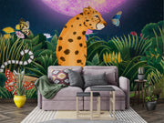 Midnight Safari wall mural with a whimsical leopard in a vibrant jungle, surrounded by butterflies and a glowing purple moon, styled in a cozy living room.