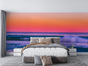 Tropical Ocean Sunset Wall Mural – Vibrant Seascape Wallpaper Featuring Rolling Waves, a Pink-Orange Twilight Sky, and a Relaxing Coastal Ambiance for Modern Interiors.