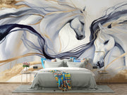 Artistic white horses wall mural featuring flowing manes, brushstroke design, and neutral beige, gold, and charcoal tones behind a bed.