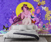 Whimsical wall mural with a muse surrounded by butterflies, vibrant florals, and a yellow moon against a purple background; decorating a bedroom.