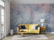 Ethereal large-scale poppy wall mural in soft blues and pinks, styled in a modern minimalist living room with a yellow sofa.