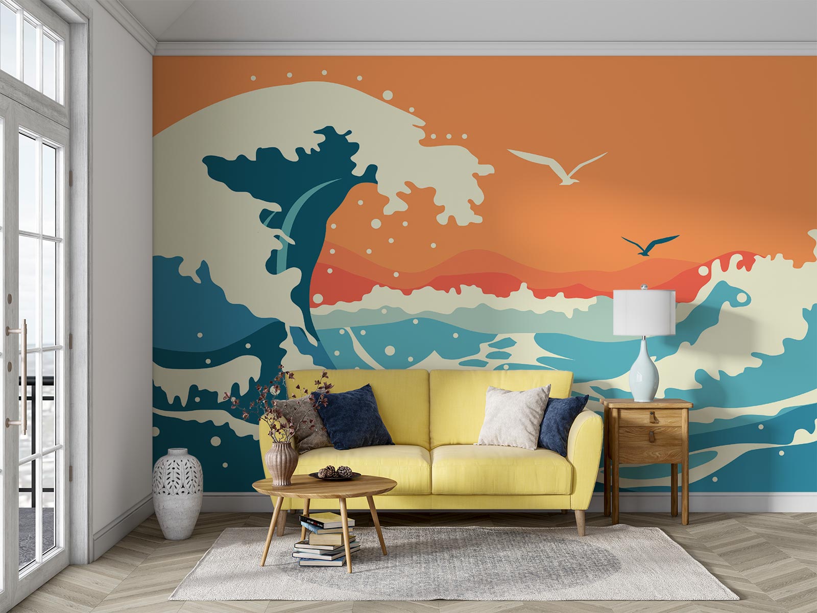 Abstract ocean wave wall mural and wallpaper in vibrant orange and blue tones, styled in a living room with a yellow sofa and wooden side table.