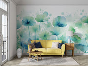 Watercolor floral wall mural featuring soft blue and green flowers in a delicate, hand-painted style, with a modern white couch and rustic decor.