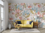 Pastel floral wall mural featuring hand-drawn flowers in pink, blue, and green tones, paired with a yellow sofa and modern living room decor.