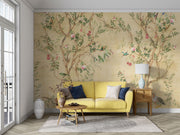 Elegant chinoiserie-style wall mural featuring delicate tree branches, blooming flowers, and colorful birds on a vintage beige background