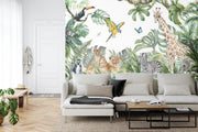 Safari adventure wall mural featuring watercolor jungle animals such as lions, giraffes, zebras, and parrots, styled in a living room.