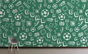 Green soccer-themed wall mural with motivational words, soccer balls and dynamic graphics; decorating  kids' room.
