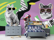 Retro pop art wall mural featuring black-and-white cats wearing colorful sunglasses, with a vibrant mix of geometric patterns, newspaper clippings, and bold colors.