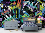 Room with colorful 'Level Up!' themed wall, bed, and furniture.