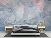 Ethereal large-scale poppy wall mural in soft blues and pinks, styled in a modern minimalist bedroom with white furniture.