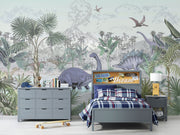 Jungle dinosaur wall mural and wallpaper featuring Stegosaurus, Brontosaurus, lush jungle plants and volcanoes; styled in a playful kid's room.